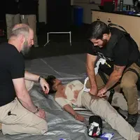 Students ripping mannequins clothes to discover wounds