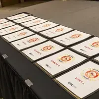 Graduation certifications on a table.