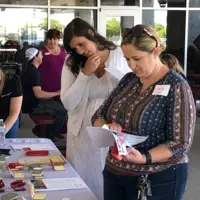 Students attending barbecue hosted by Saint Alphonsus Aug. 27, 2019