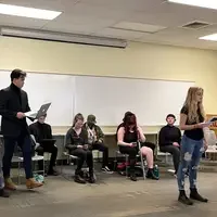 Students performing a readers theater