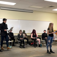 Students performing a readers theater