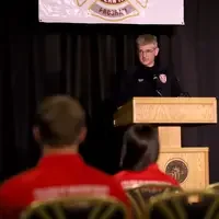Darrin Raskopf, Director of Fire Service Technology, greets graduates during the ceremony on May 6.