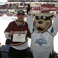 Jeremy Wright, SCORE Big Scholarship recipient, with Idaho Steelheads mascot, Blue.