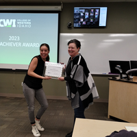 Andrea Schumaker receiving an award