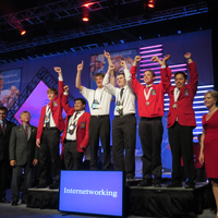 Carlos Gonzales (right) celebrates his silver medal on the podium.