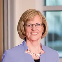 An executive headshot of a woman.