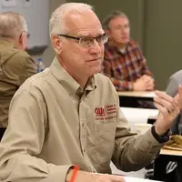 Brand Champion, Rob Green, participating in discussion of CWI logo draft concepts.