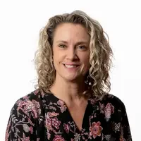 A portrait headshot of Jodi Hickenlooper against a white backdrop.