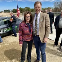 CWI President, Gordon Jones, and Mayor Debbie Kling of Nampa, Idaho stand together and smile for a picture.