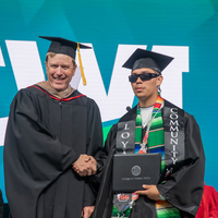 Student accepting diploma