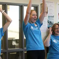Martha Timberlake, Michelle Fellows, and Jana McCurdy enjoying the band, Afrosonics