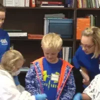 Dental Assisting Program students demonstrating oral health with elementary students.