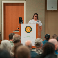 Student behind podium