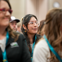 Student watches ceremony in the crowd