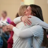 Students hug