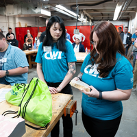 Students attend an event and examine rocks mined from a quarry.