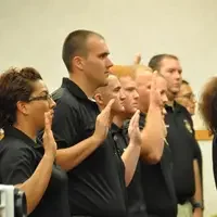 Graduates recite the Peace Officer Code of Ethics.