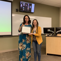 Emily McIntier receiving an award