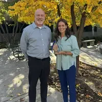 Greg Wilson presenting Heather Schoenherr the GEM Award for Social and Behavioral Ways of Knowing