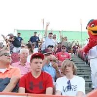 Fans in the CWI section catching swag thrown out by the Enrollment team