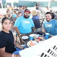 CWI graduate, Marcos Serratos-Garcia, his daughter, enjoying the VIP picnic before the game