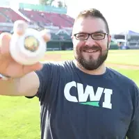 CWI graduate, Ashton Syed, preparing to throw out the first pitch