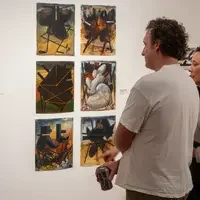 People checking out wall art