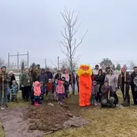 Tree planting attendees posing for a picture