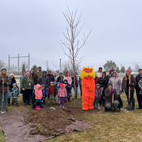 Tree planting attendees posing for a picture
