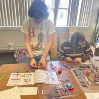 Student using material from Pop the Trunk