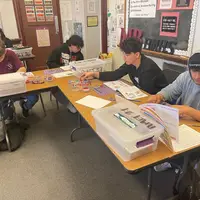 Students working on activites from Pop the Trunk