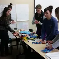 Education students wrapping donations for local shelter.