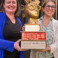 Winners hold their certificates at a faculty professional development event.