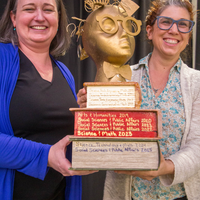 Winners hold their certificates at a faculty professional development event.