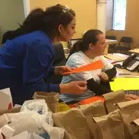 Dental Student working on computer completing patient records