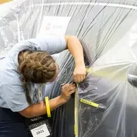Student competing in Automotive Refurbishing