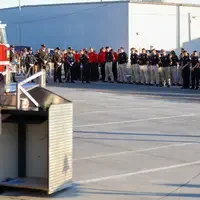 Students bowing heads in moment of silence