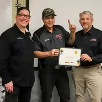Smiling student recieving certificate