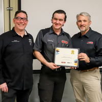 Student recieving training certificate