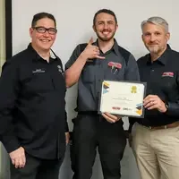 Student and faculty with training certificate