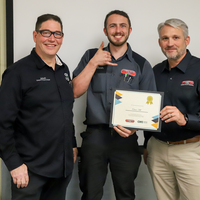 Student and faculty with training certificate
