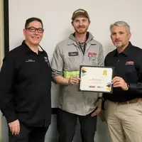 Student and faculty at graduation ceremony