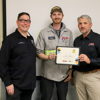 Student and faculty at graduation ceremony
