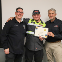 Student and faculty celebrating training completion