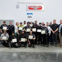 Faculty, Commercial Tire students and employees in a CWI auto lab