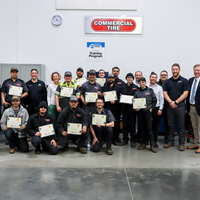 Faculty, Commercial Tire students and employees in a CWI auto lab