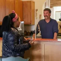 Student and Dr. Lung at countertop