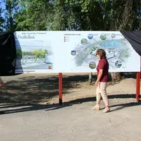 CWI's Board of Trustees unveil a sign with development plans for the College's Boise campus.
