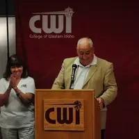 Mary (M.C.) Niland at podium with Bert Glandon