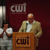 Mary (M.C.) Niland at podium with Bert Glandon